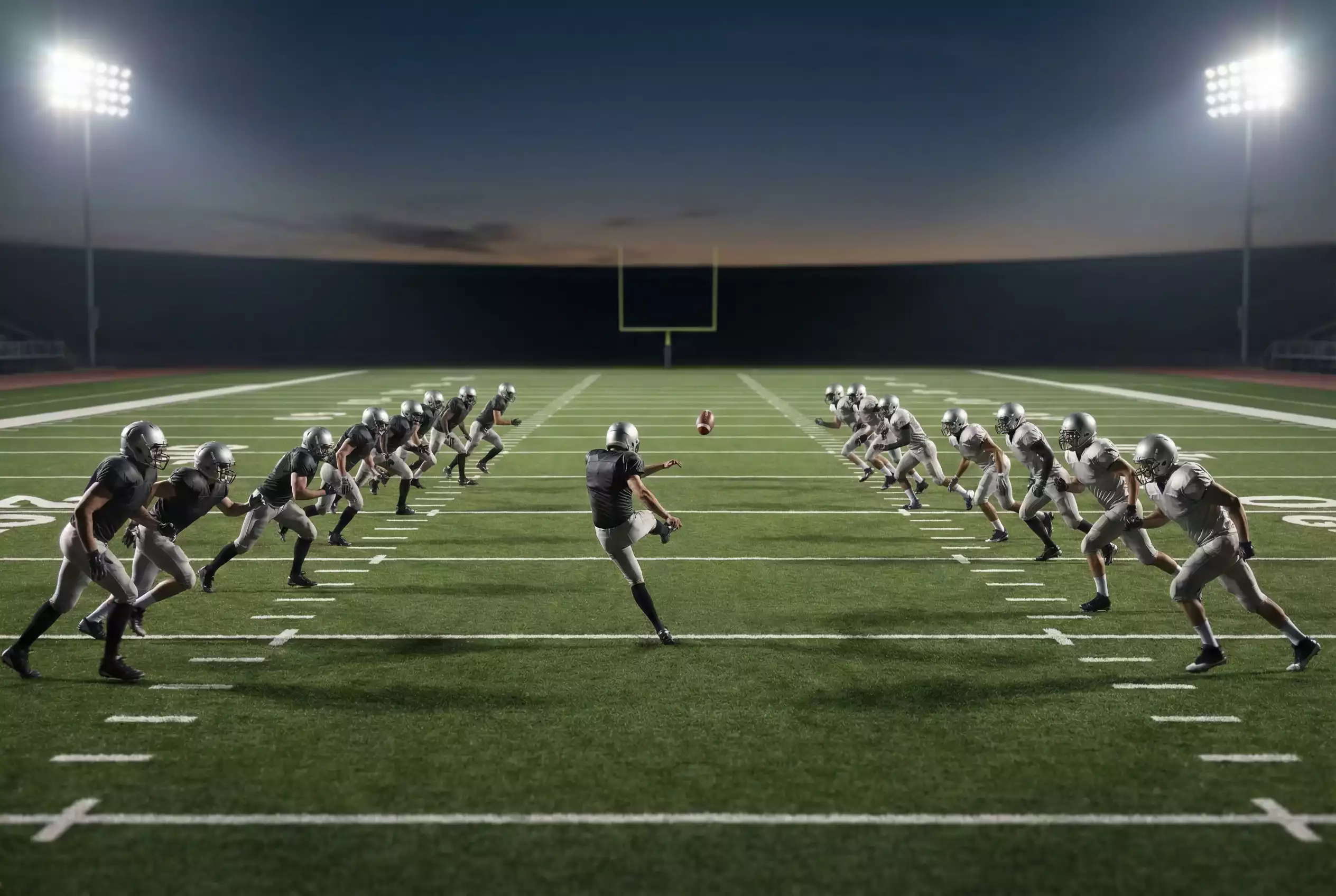 NFL-Spielfeld mit Spielern beim Kickoff zu Beginn einer Partie